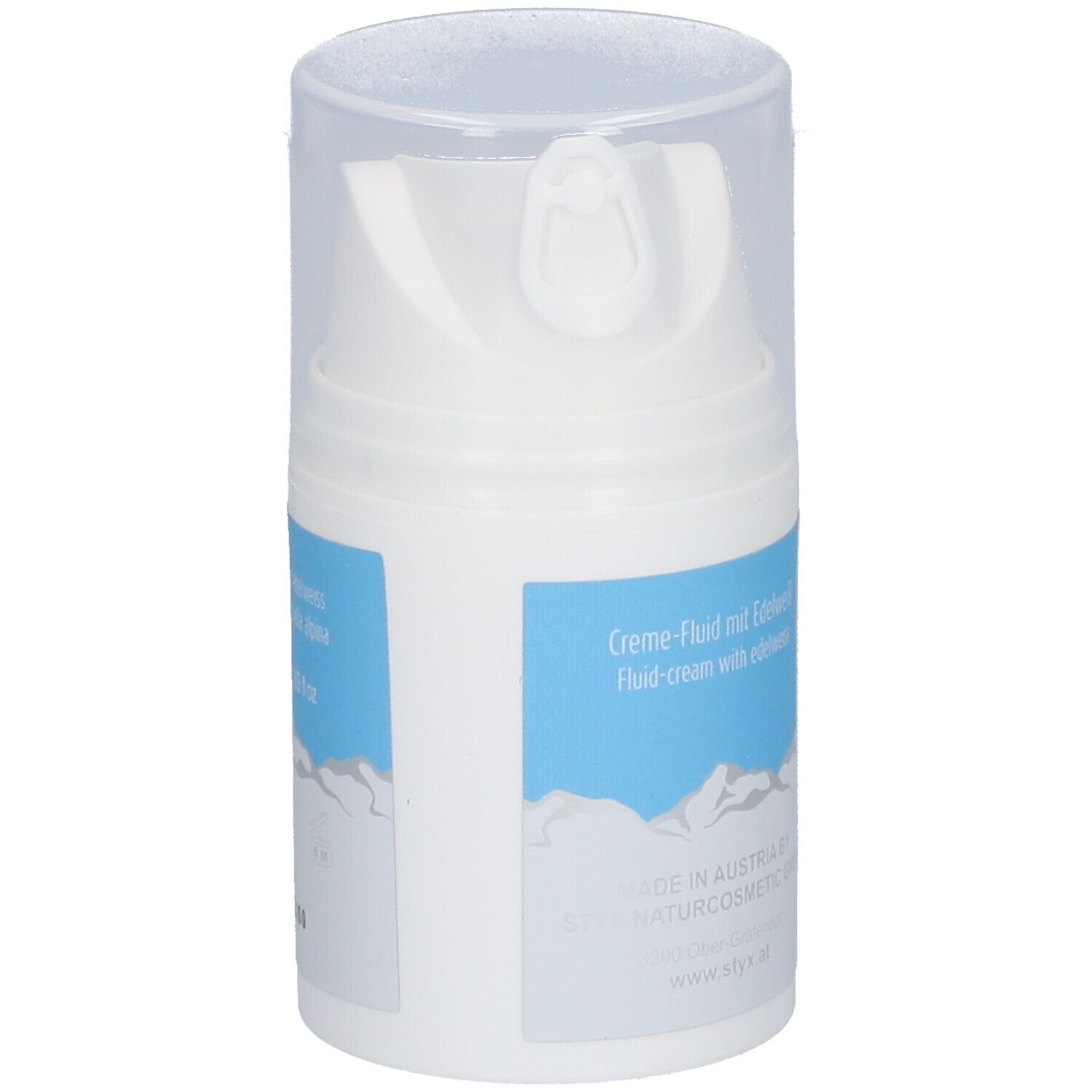 Distributeur blanc avec étiquette bleue. Inscription STYX, alpin derm Creme-Fluid. Avec Edelweiss & Lait de brebis. Fabriqué en Autriche.