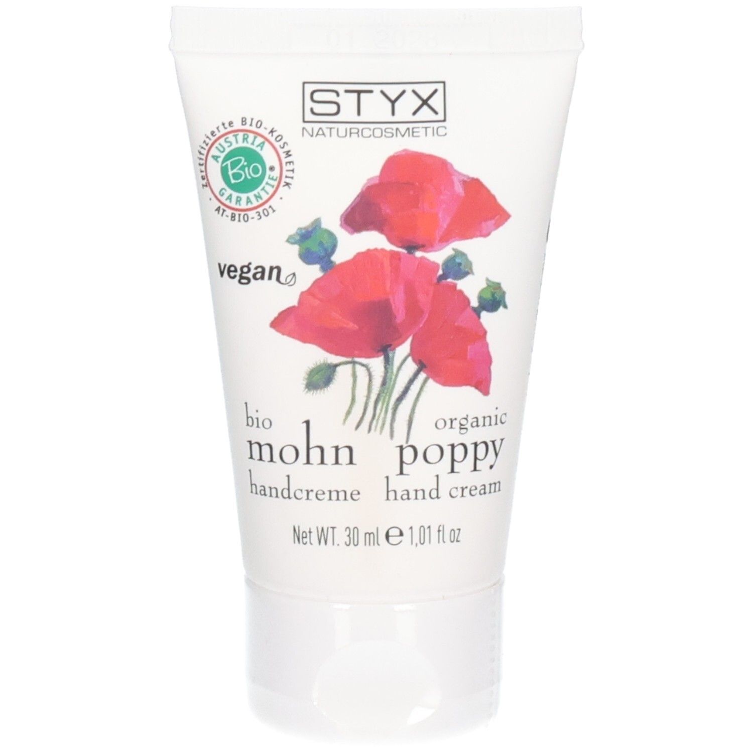 Tube blanche avec motif de coquelicots rouges. Logo STYX NATURCOSMETIC, texte "vegan" et "bio".