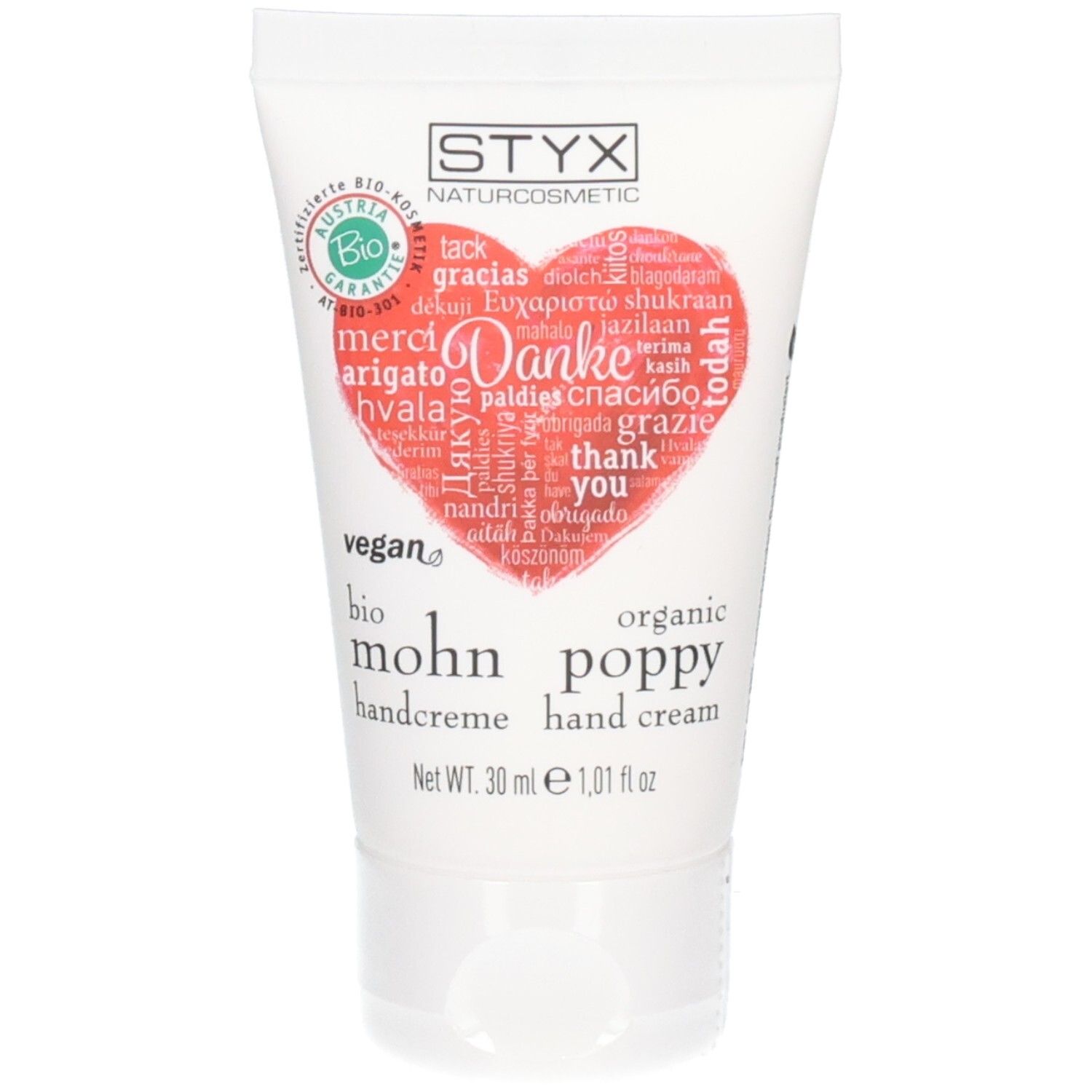 Tube de crème pour les mains avec cœur rouge et "Merci" multilingue. Logo : STYX Naturcosmetic, label bio.
