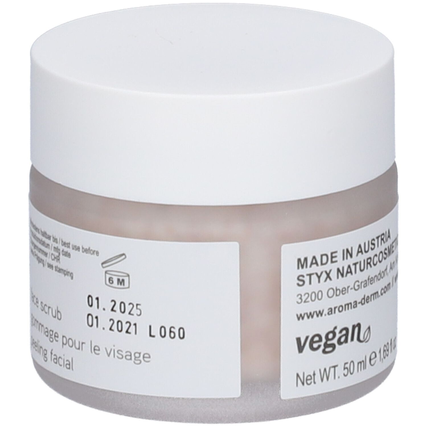 Pot de crème avec couvercle blanc. Étiquette avec texte et date de péremption. Sceau végétalien.
