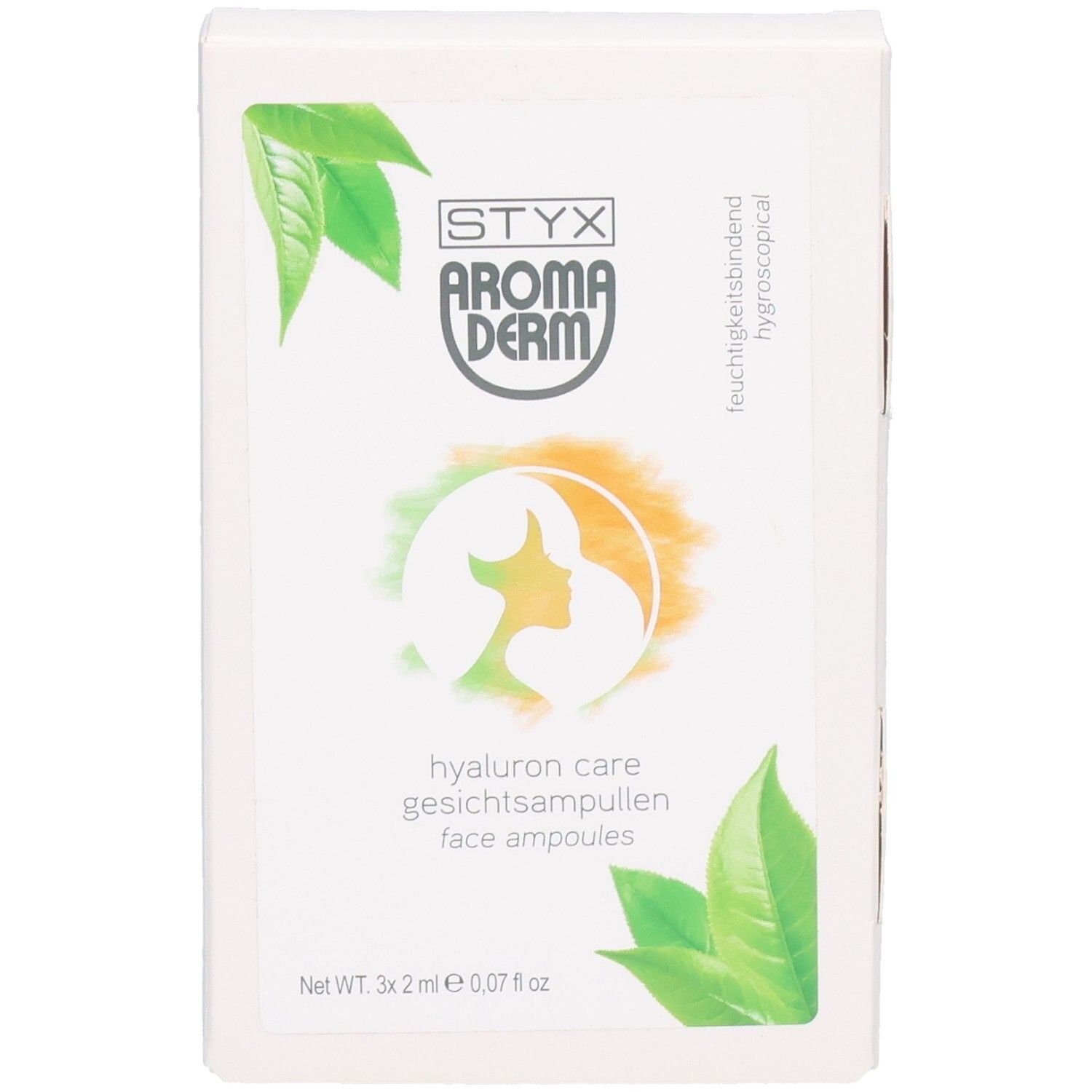 Boîte blanche avec STYX AROMADERM Hyaluron Care Gesichtsampullen. Logo, feuilles vertes et nom du produit.