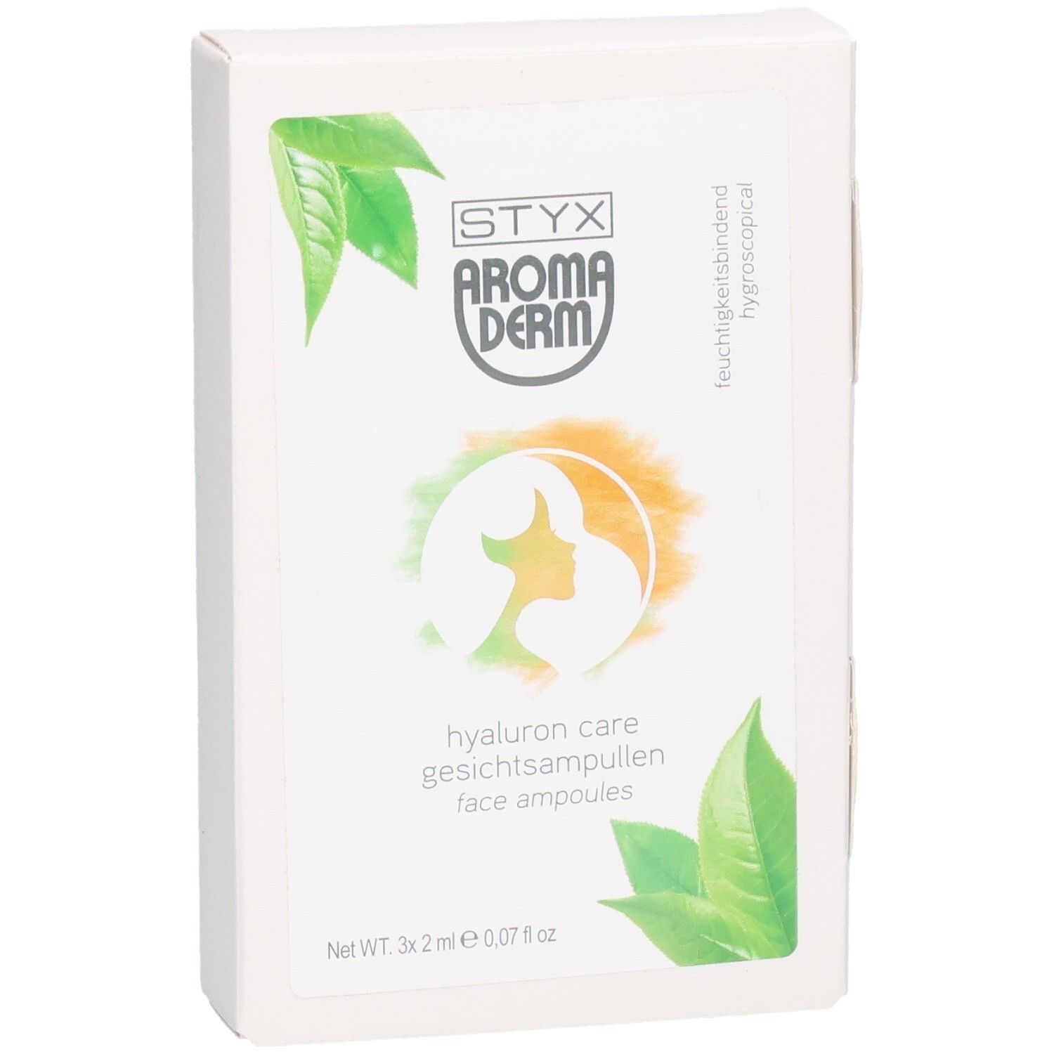 Boîte blanche avec STYX AROMADERM Hyaluron Care Gesichtsampullen. Logo, feuilles vertes et nom du produit.