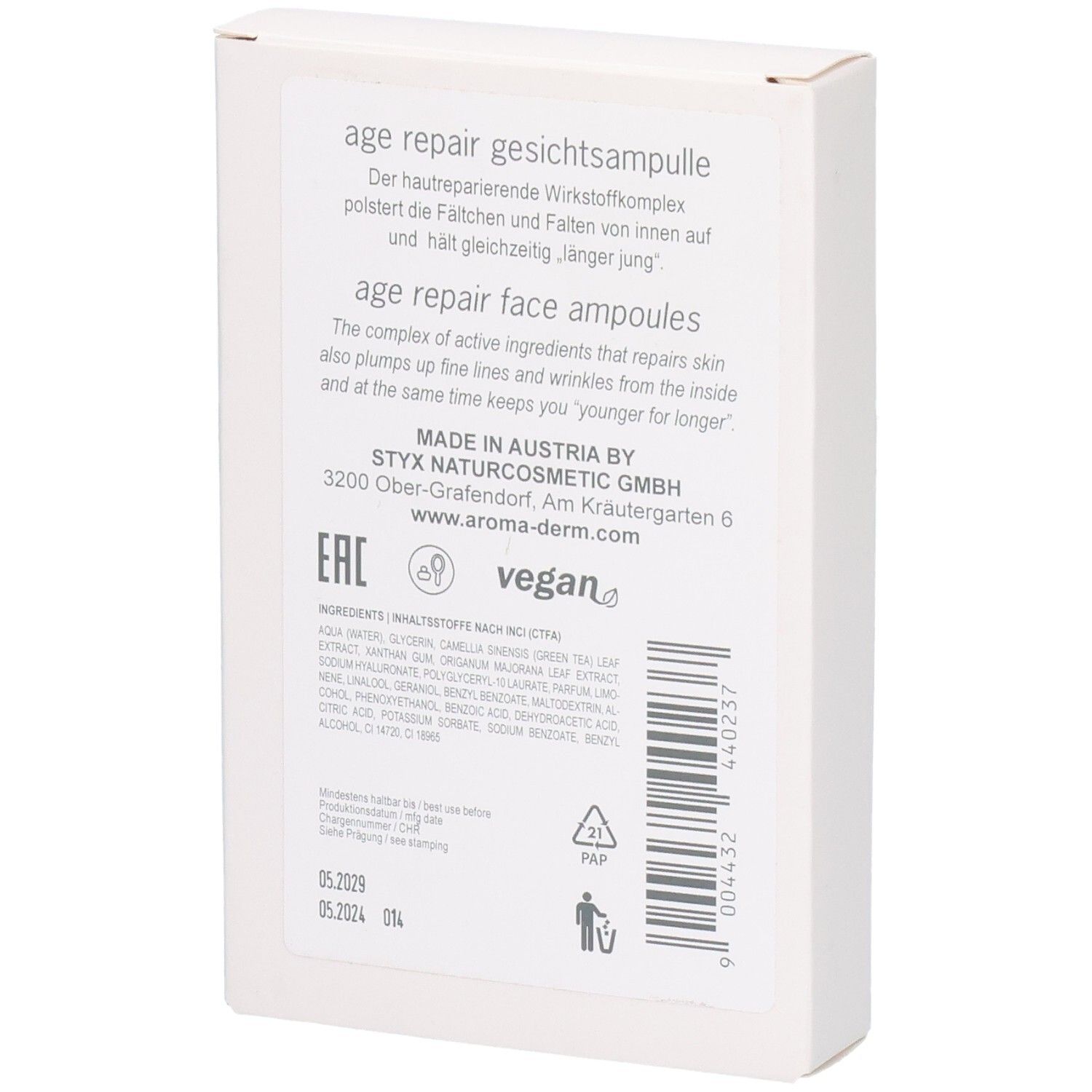 Dos de la boîte blanche. Texte avec informations sur le produit, ingrédients, adresse du fabricant et label vegan.