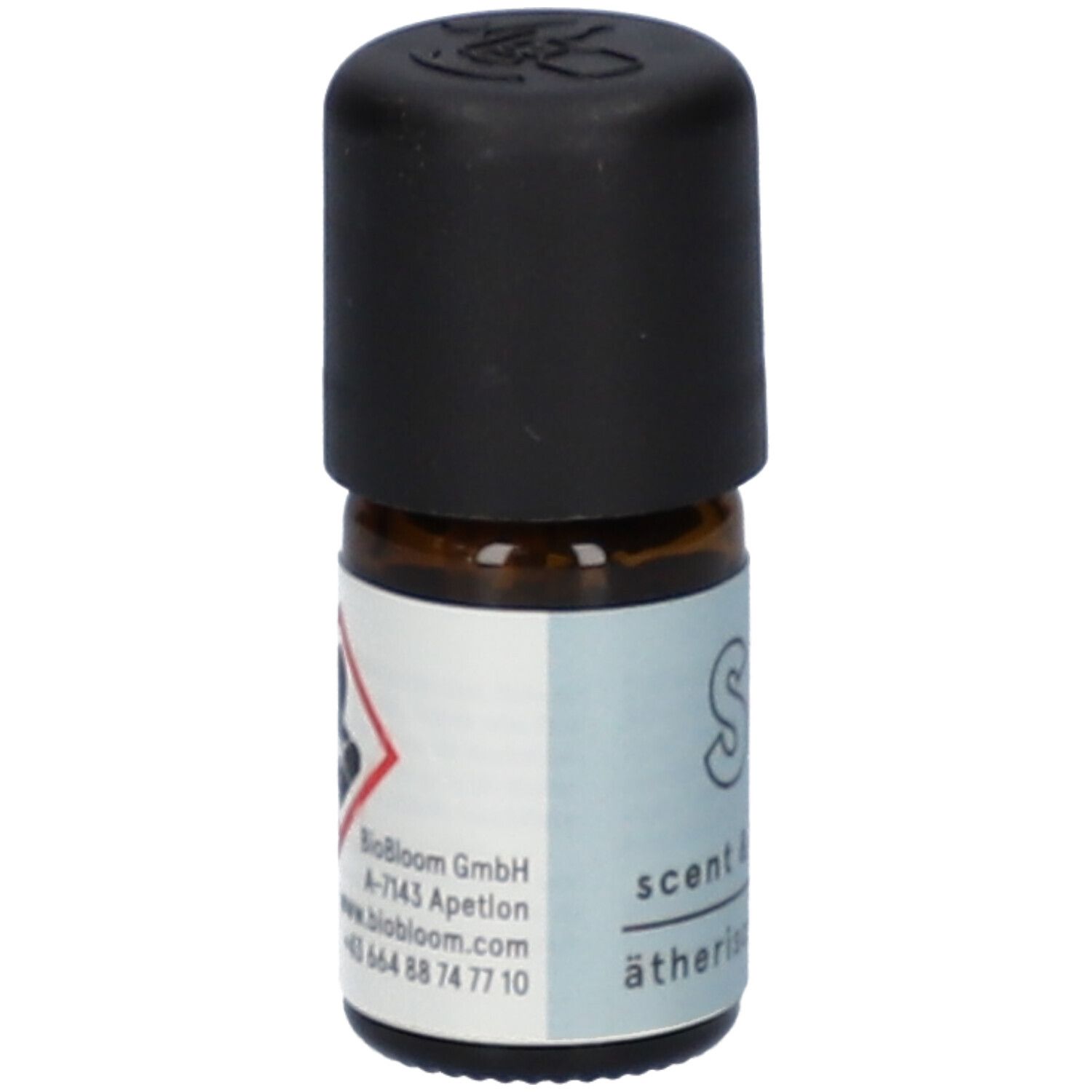 Flacon en verre brun avec bouchon noir. Étiquette "Scent & Sleep", "ätherisches Öl" et symbole de danger.