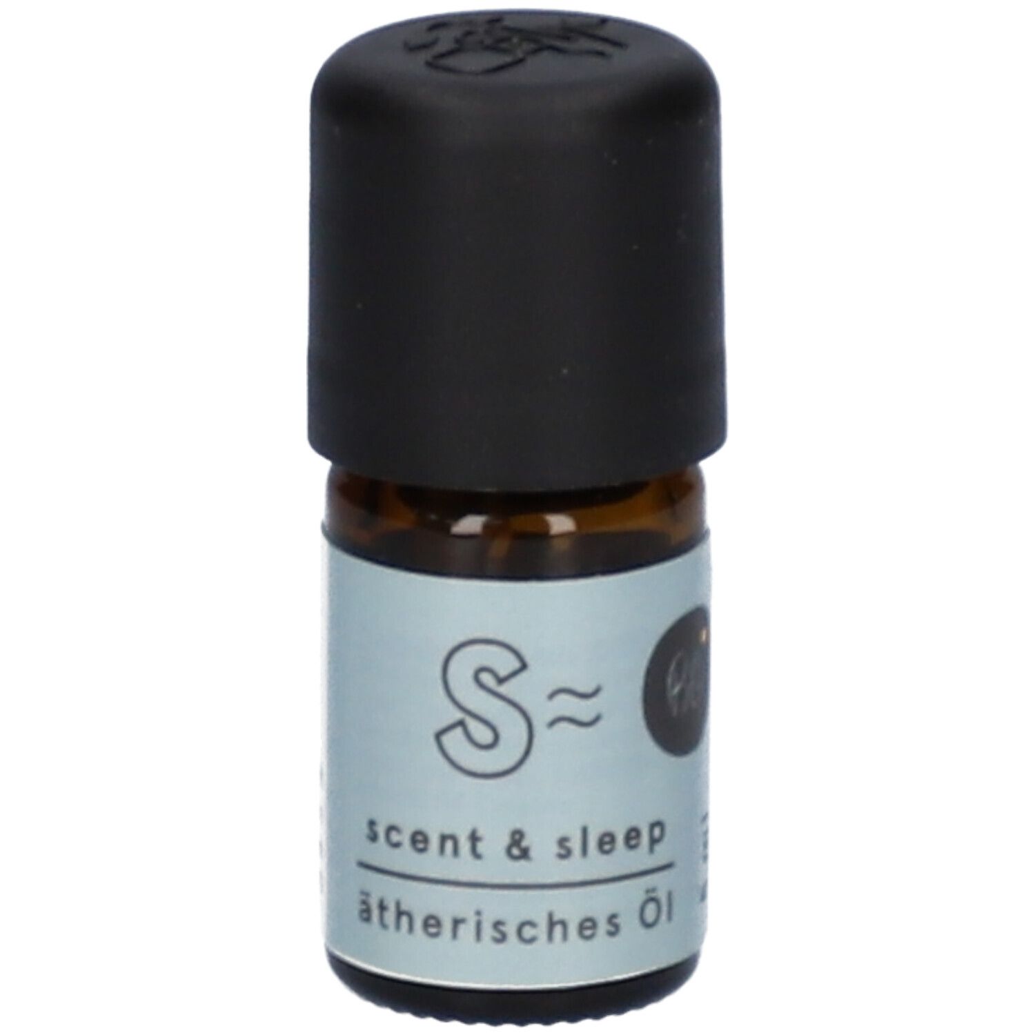 Flacon en verre brun avec bouchon noir. Étiquette "Scent & Sleep" et "ätherisches Öl".