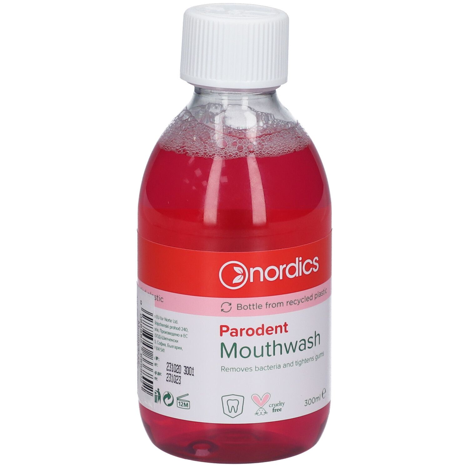 Bain de bouche Nordics Parodent dans une bouteille transparente avec bouchon blanc. Liquide rouge avec mousse.