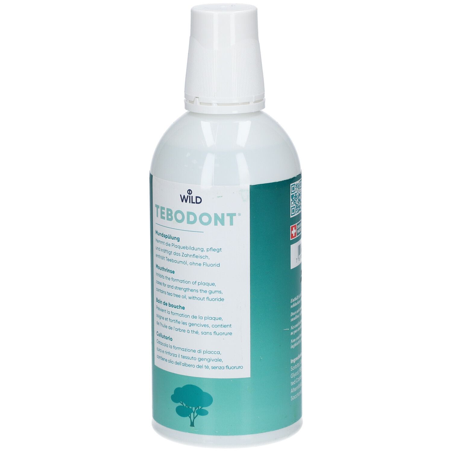 Bouteille blanche avec étiquette verte. Inscription: TEBODONT Bain de bouche. Croix suisse.