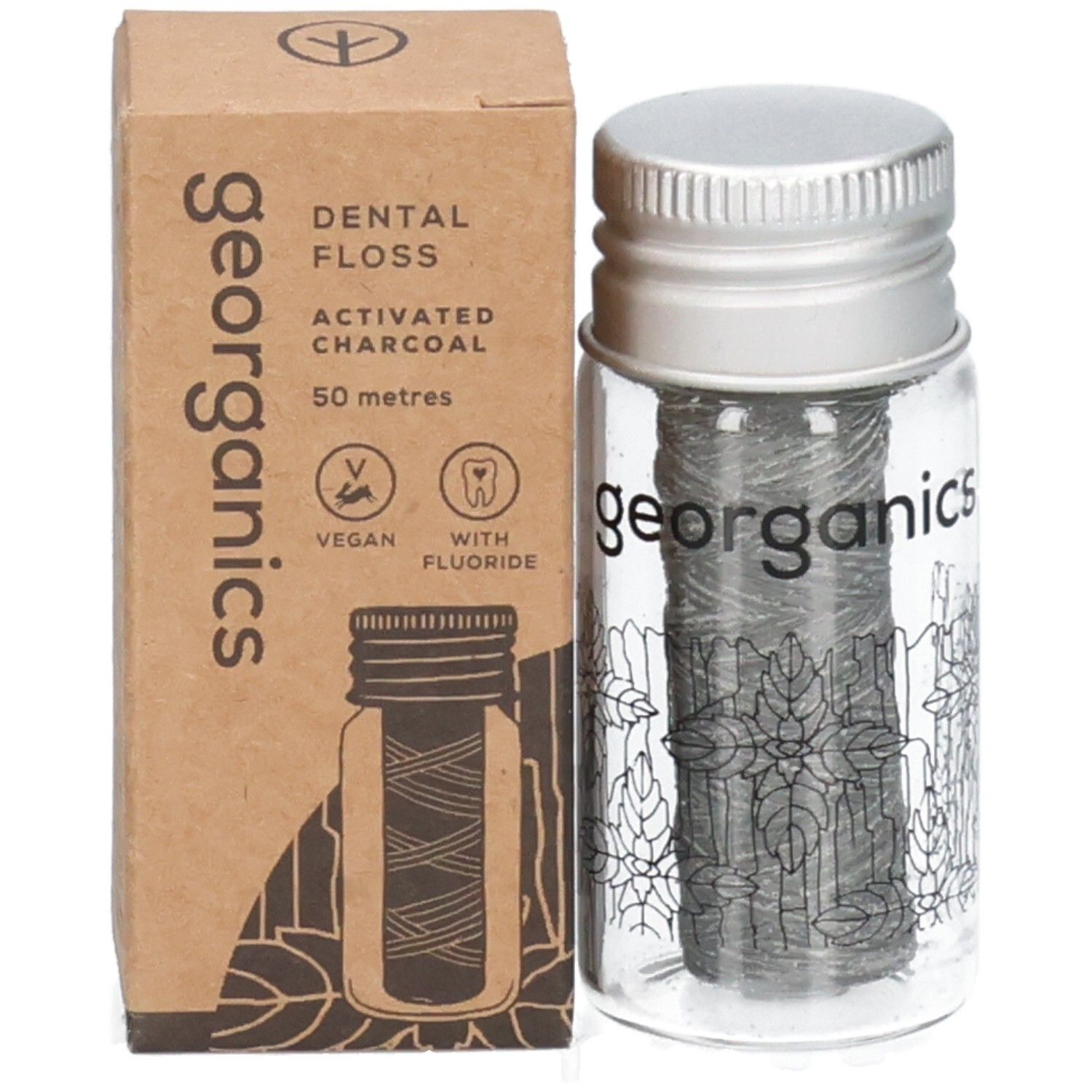 Fil dentaire avec emballage. Flacon en verre avec bouchon à vis et carton. Inscription : georganics, Dental Floss, charbon actif.