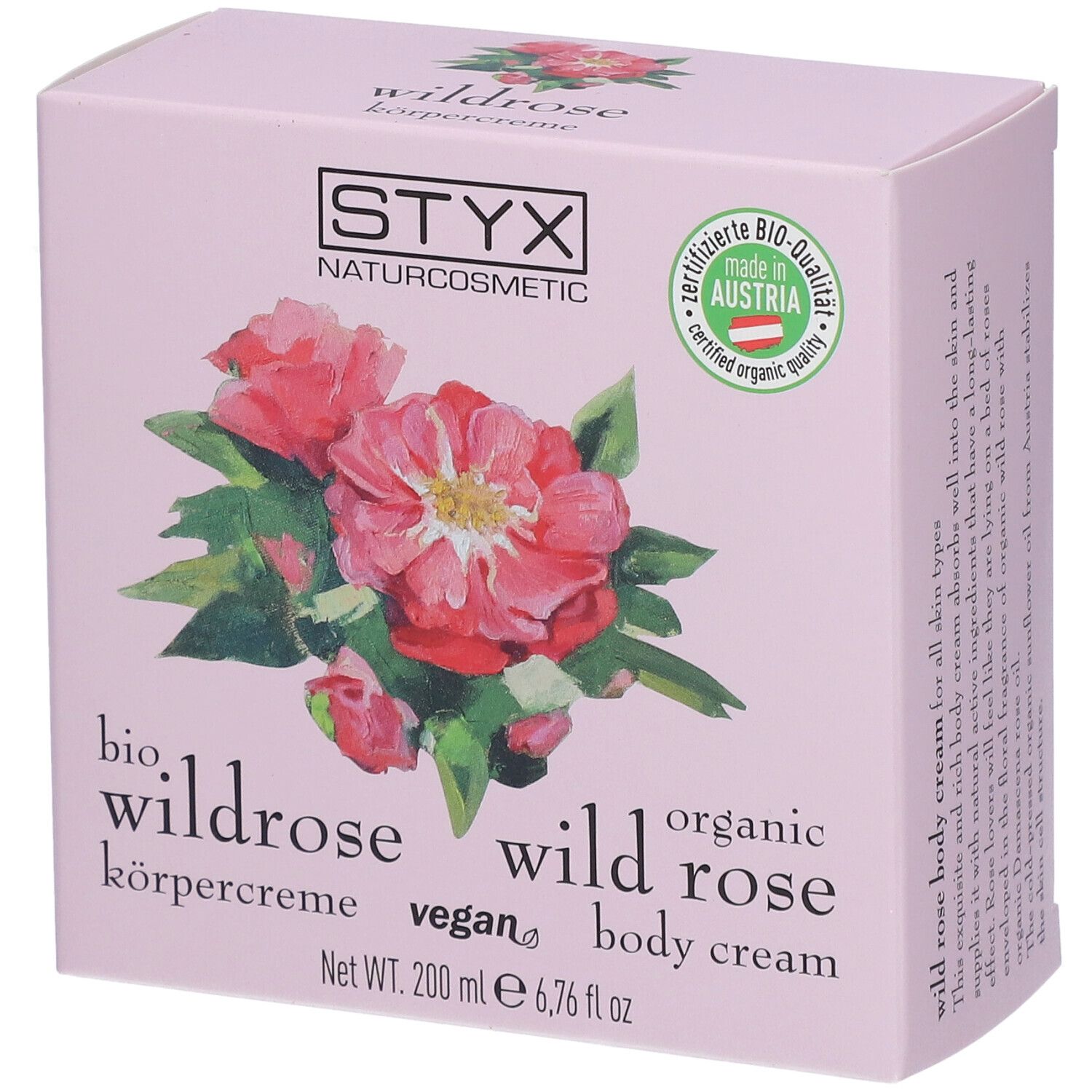 Boîte de crème pour le corps rose avec logo STYX, illustration de rose sauvage et label de qualité bio.