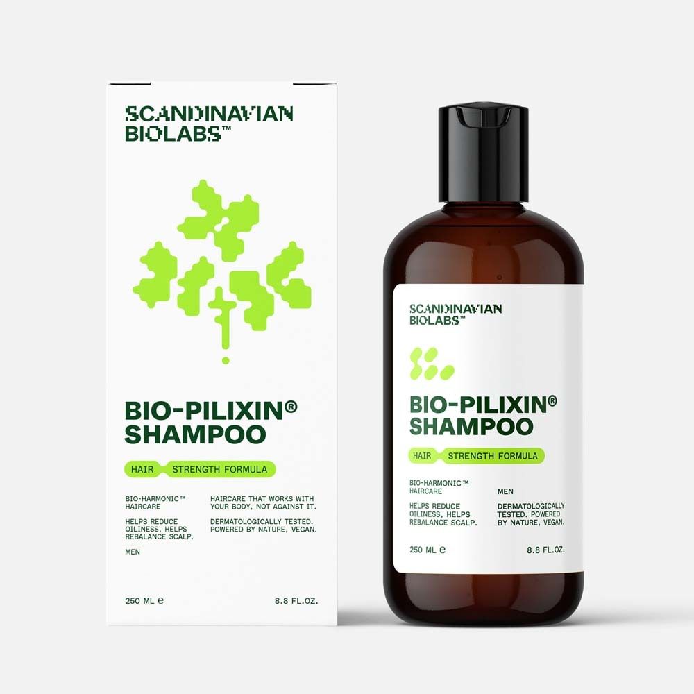 Flacon et emballage de shampooing Bio-Pilixin. Étiquette blanche avec logo et informations. 250 ml.