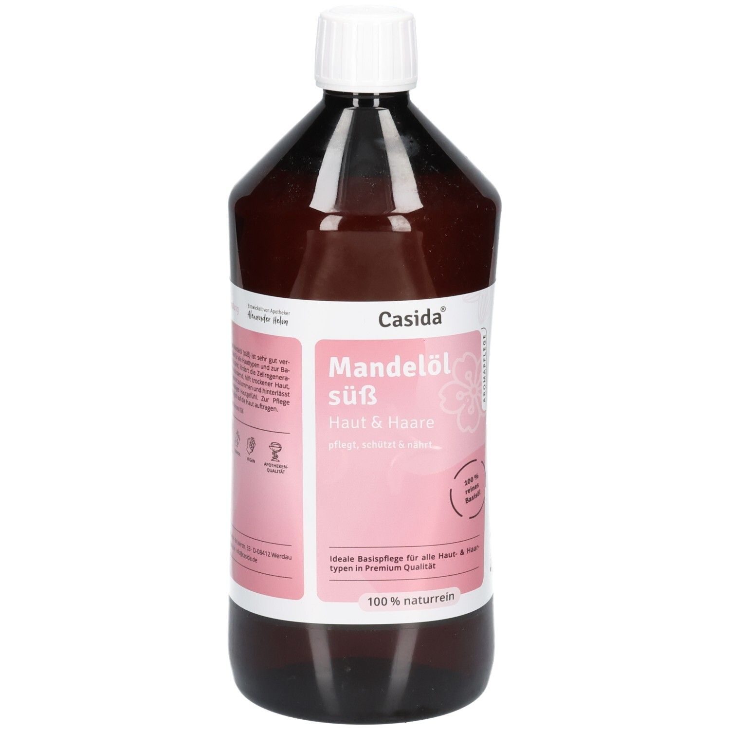 Flacon brun avec bouchon blanc. Étiquette avec nom du produit et marque Casida. Texte : Huile d'amande douce, 100% naturelle.
