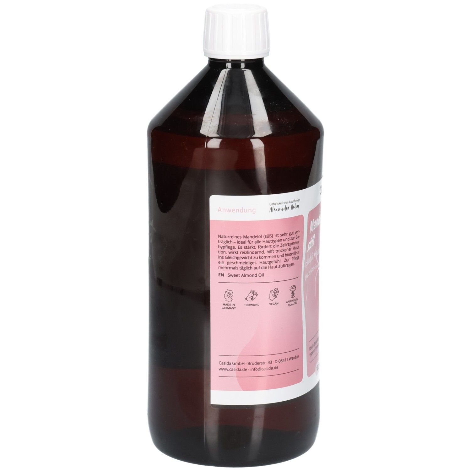 Flacon brun avec bouchon blanc. Étiquette avec informations sur le produit. Texte : Utilisation, ingrédients, Casida Huile d'amande douce.