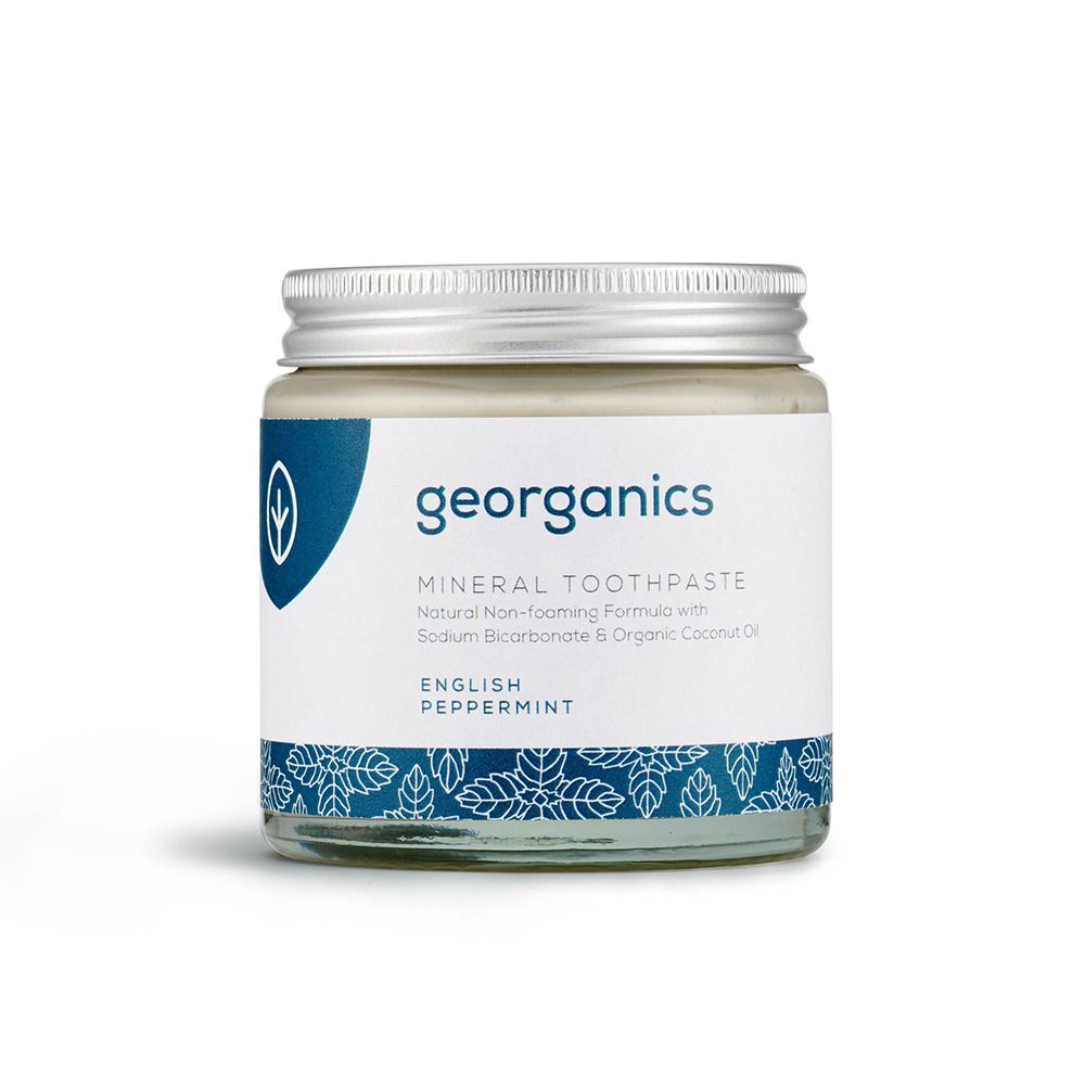 Pot de dentifrice en verre avec couvercle à vis. Étiquette avec logo et nom du produit: English Peppermint.