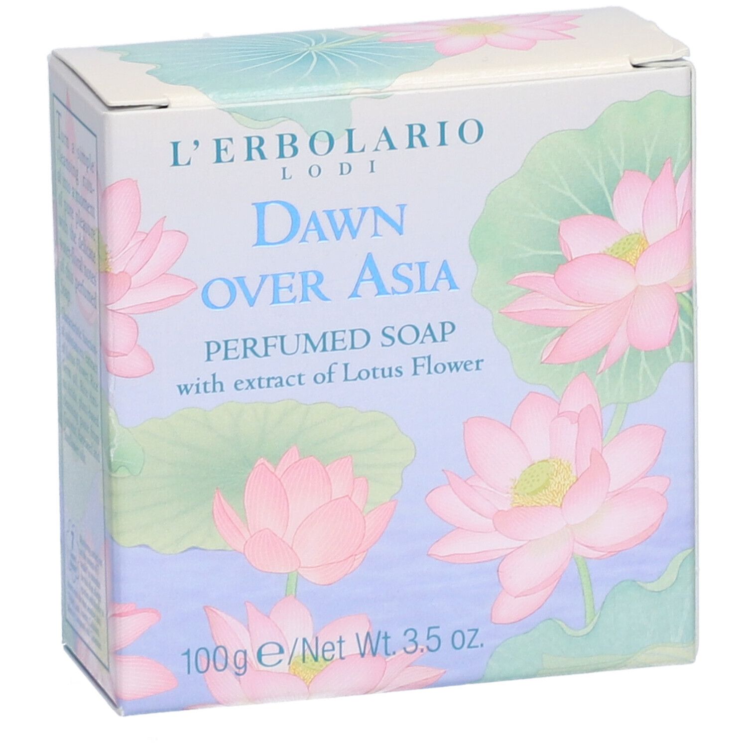 Boîte avec fleurs de lotus roses et texte "Dawn Over Asia". Contient du savon parfumé à l'extrait de fleur de lotus. 100g.