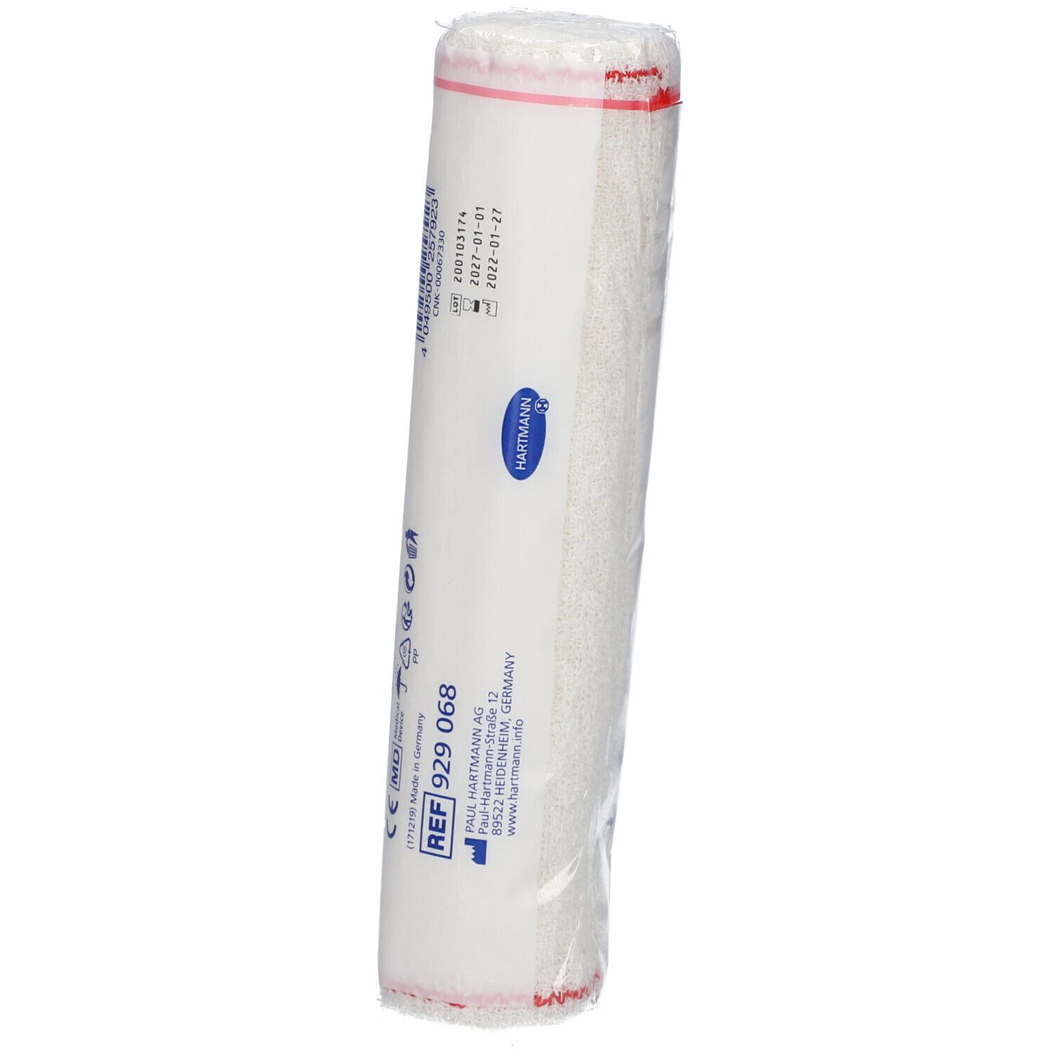 Bandage roulé sous film. Inscription: Hartmann, numéro de référence, numéro de lot, date de péremption. Matériau de bandage blanc.