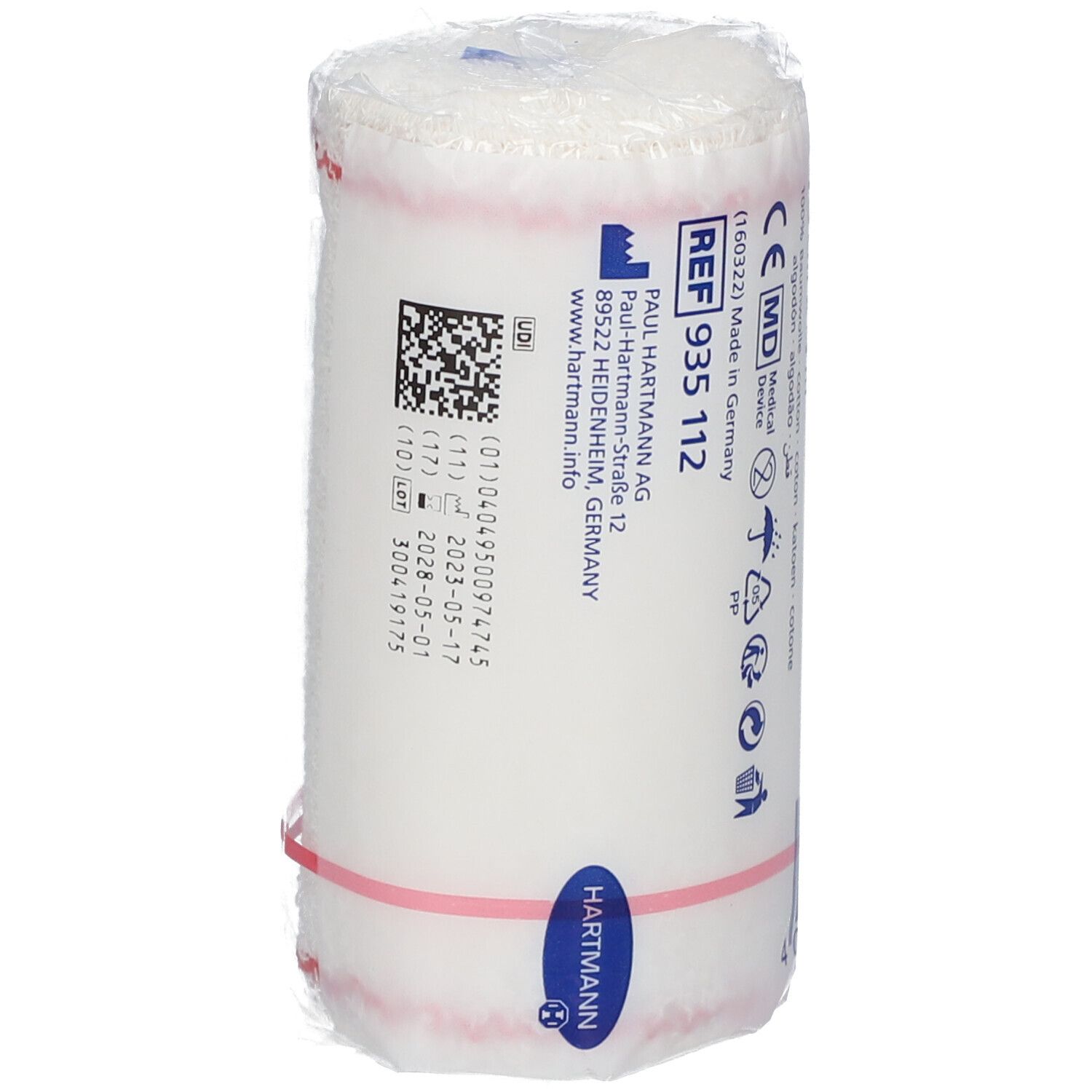 Rouleau de bandage crêpe blanc sous film. Inscription: Hartmann, REF 935 112, marquage CE. Données de production.