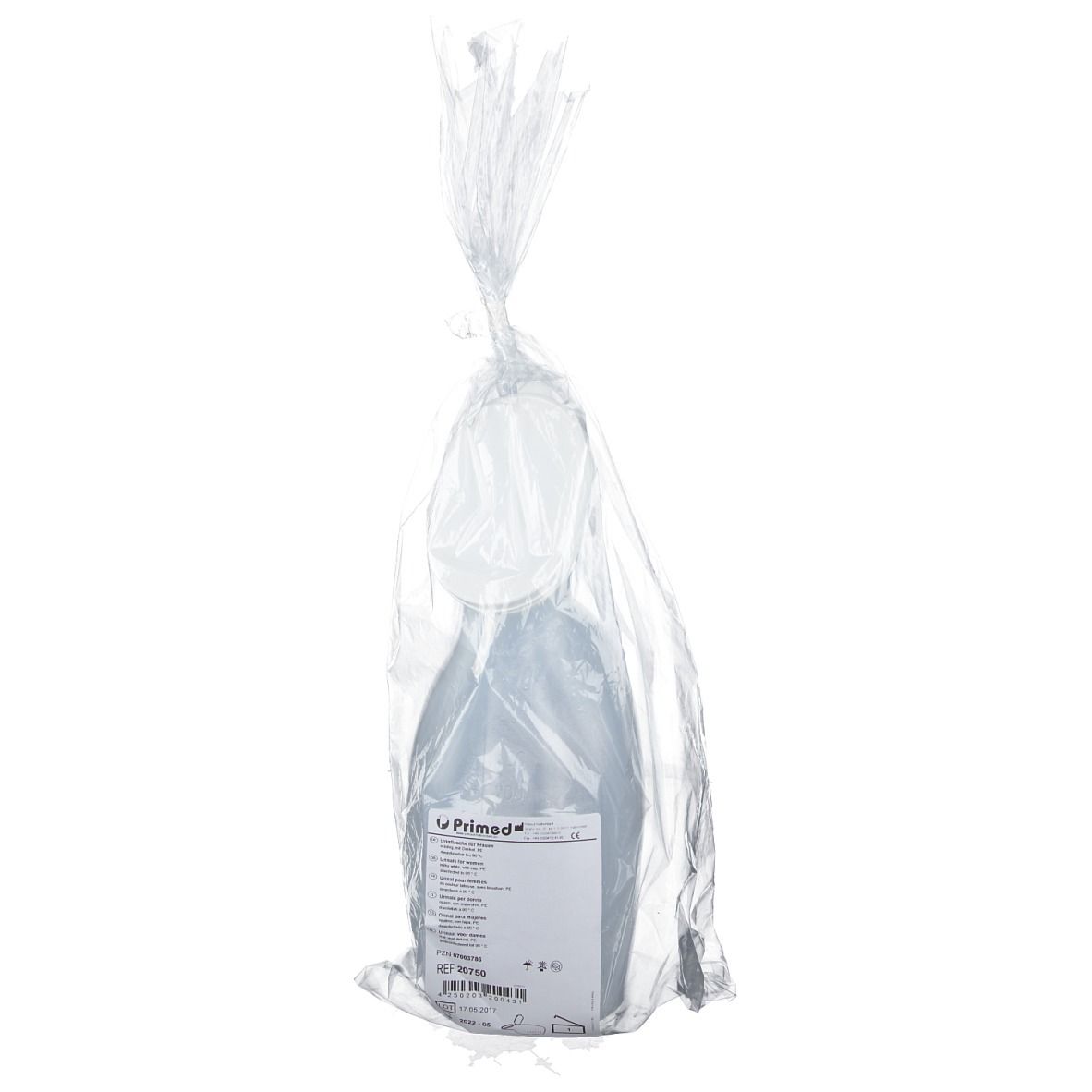 Urinal dans un emballage plastique transparent. Étiquette avec informations sur le produit visible.