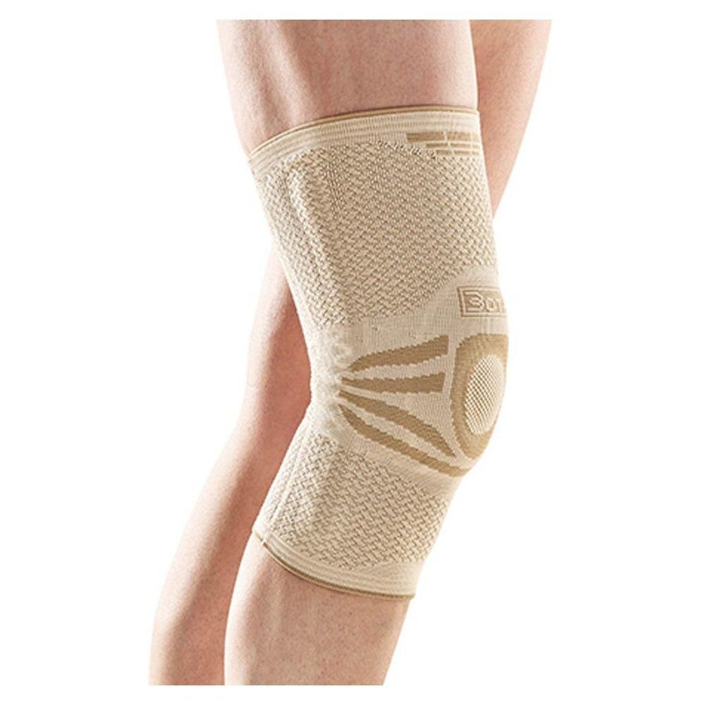 Genouillère beige. Tricot avec accents bruns. Montre l'articulation du genou. Sans autres détails.