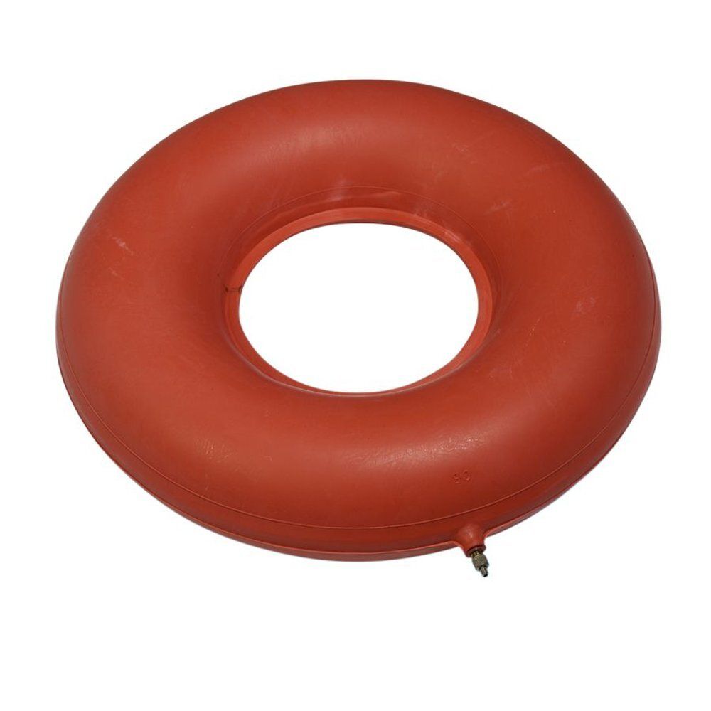Coussin gonflable en caoutchouc rouge, en forme d'anneau. Avec valve de gonflage.
