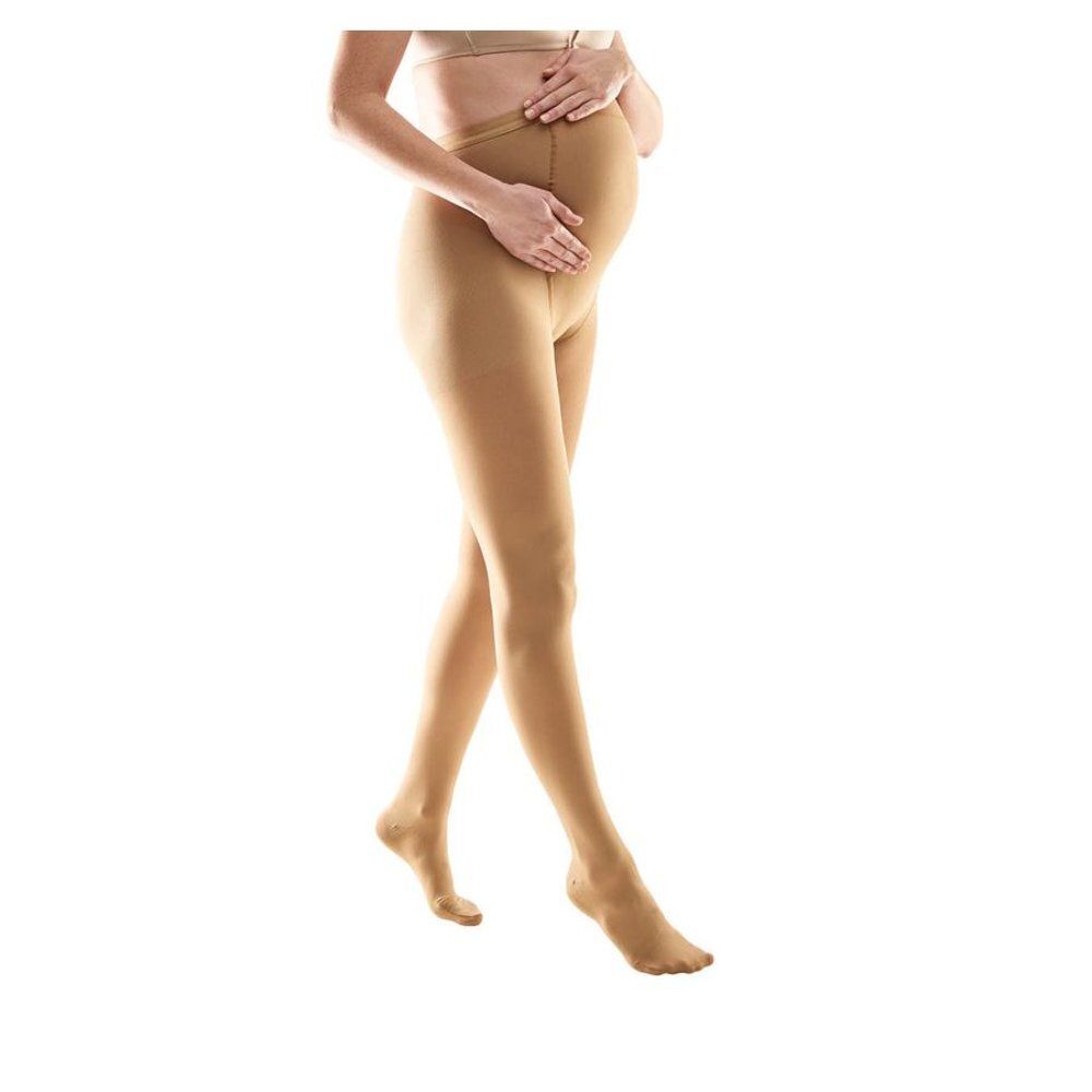 Collant de compression marron. Une femme enceinte porte le collant. Le produit est visible.