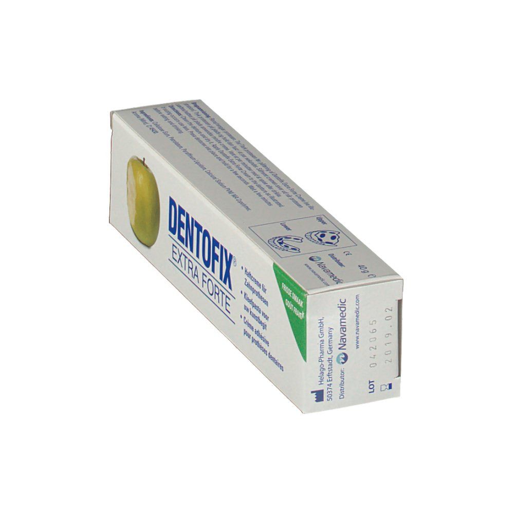 Boîte DentoFix Extra Forte. Emballage blanc avec accent vert et illustration de pomme. Texte: Crème adhésive pour prothèses dentaires.
