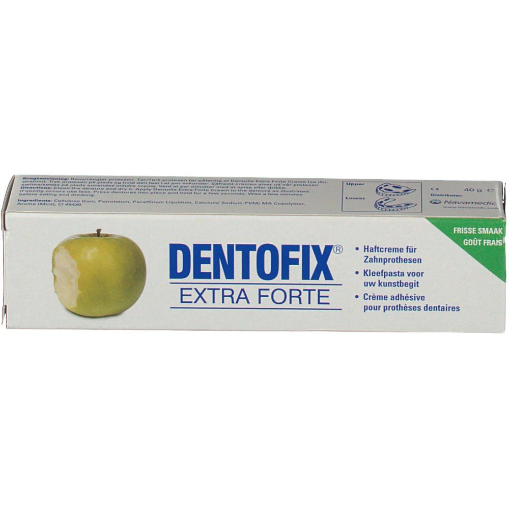 Boîte DentoFix Extra Forte. Emballage blanc avec accent vert et illustration de pomme. Texte: Crème adhésive pour prothèses dentaires.