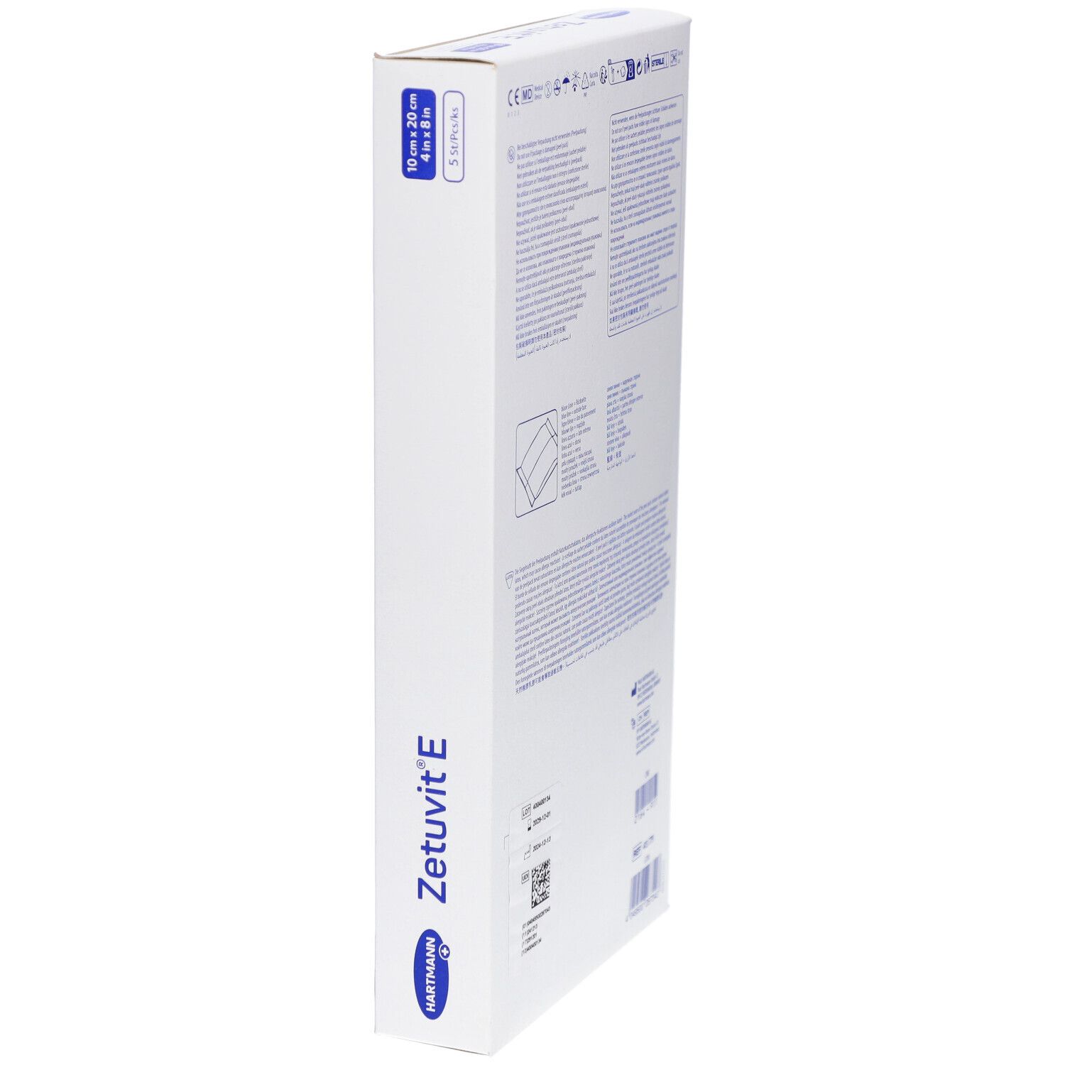 Côté de l'emballage Hartmann Zetuvit E. Inscription : 10 cm x 20 cm, 5 pièces/paquet. Nom du produit et marque visibles.