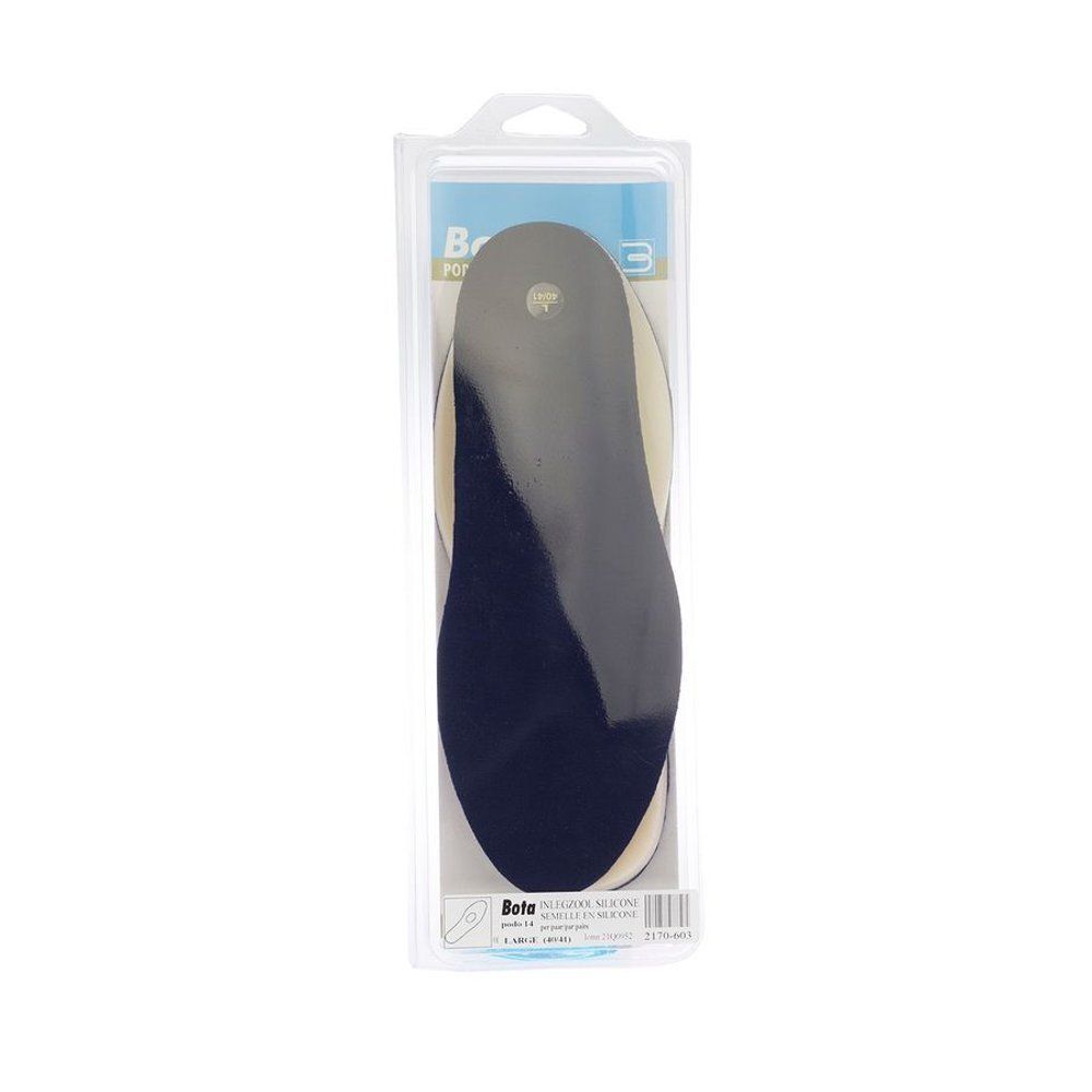 Emballage contenant deux semelles intérieures, une bleu foncé et une blanche.
