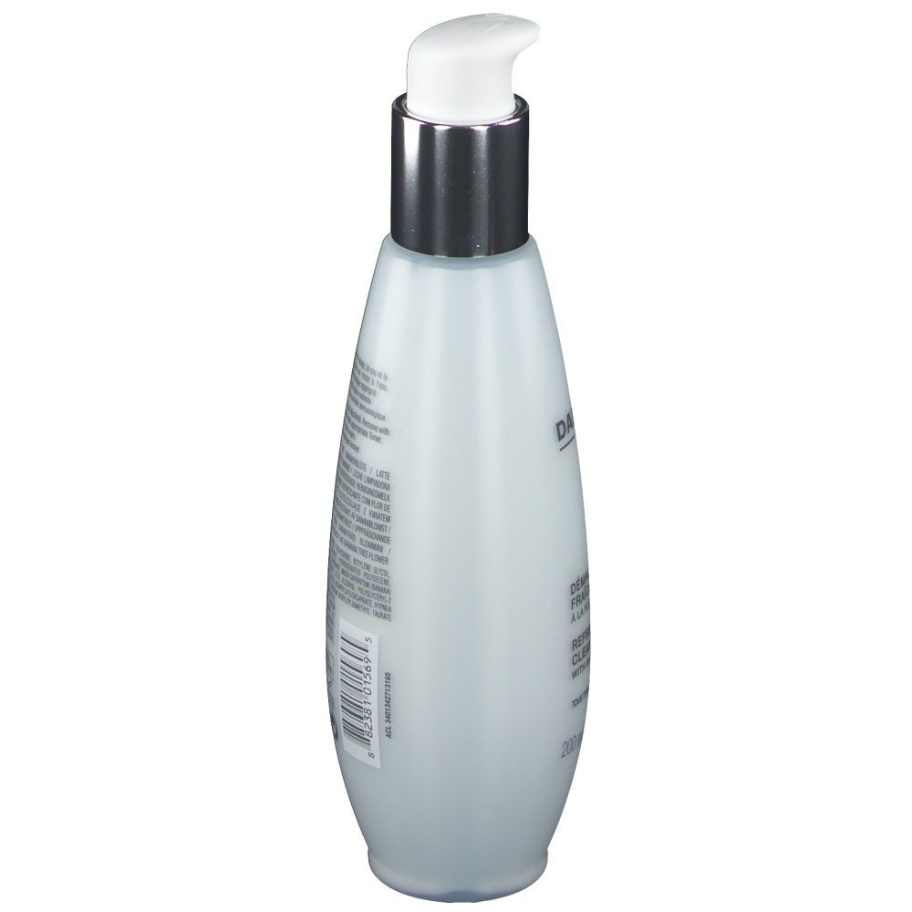 Flacon blanc avec pompe argentée, vue latérale. Texte et code-barres.