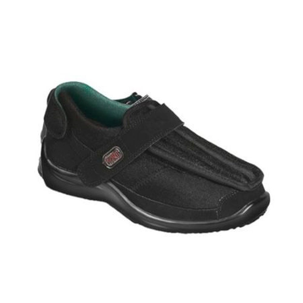 Chaussure noire avec fermeture velcro. Logo Podartis visible. Semelle intérieure verte. Vue détaillée.