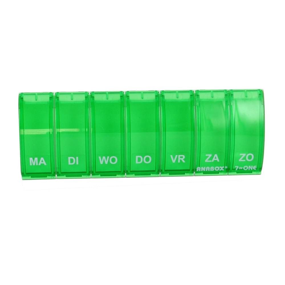 Pilulier vert à sept compartiments, étiquetés avec les jours de la semaine. "ANABOX" et "7-ONE" sont visibles.