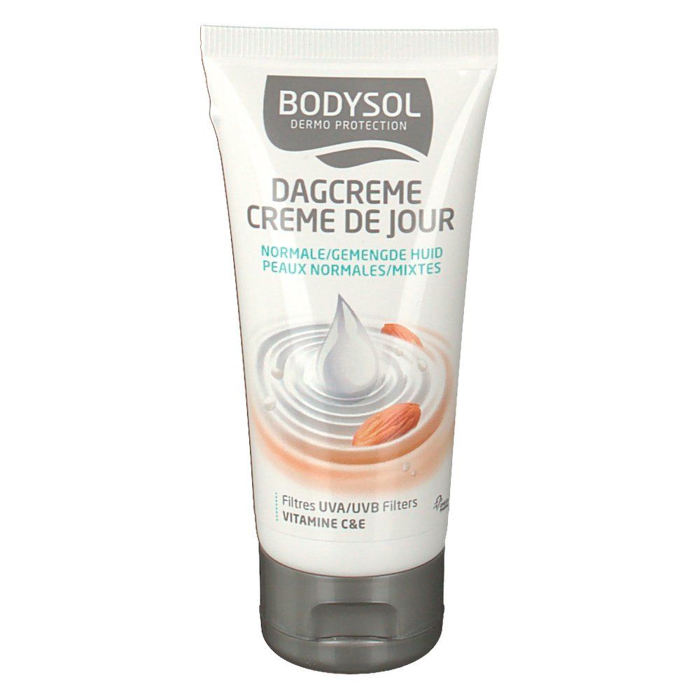 Tube de crème avec nom et illustration du produit. Contient des filtres UVA/UVB et de la vitamine C&E. Pour peaux normales.