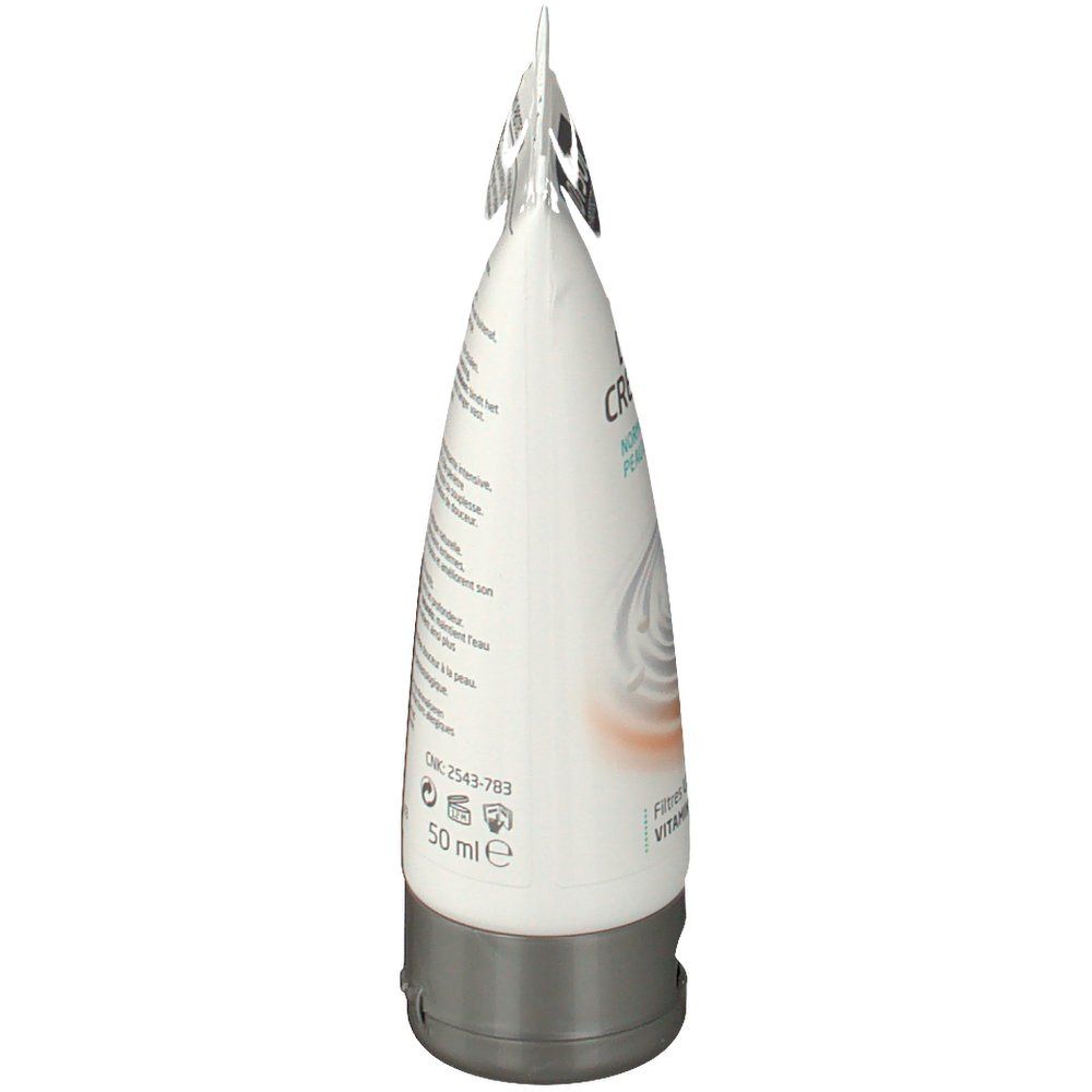 Vue latérale du tube de crème. Texte sur le tube. Contient des informations sur les ingrédients et l'utilisation.