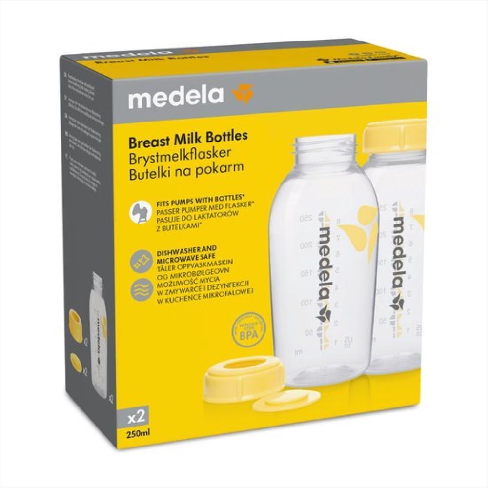 Boîte de biberons Medela. Deux biberons, bouchons jaunes. Inscription "Breast Milk Bottles". Label BPA.