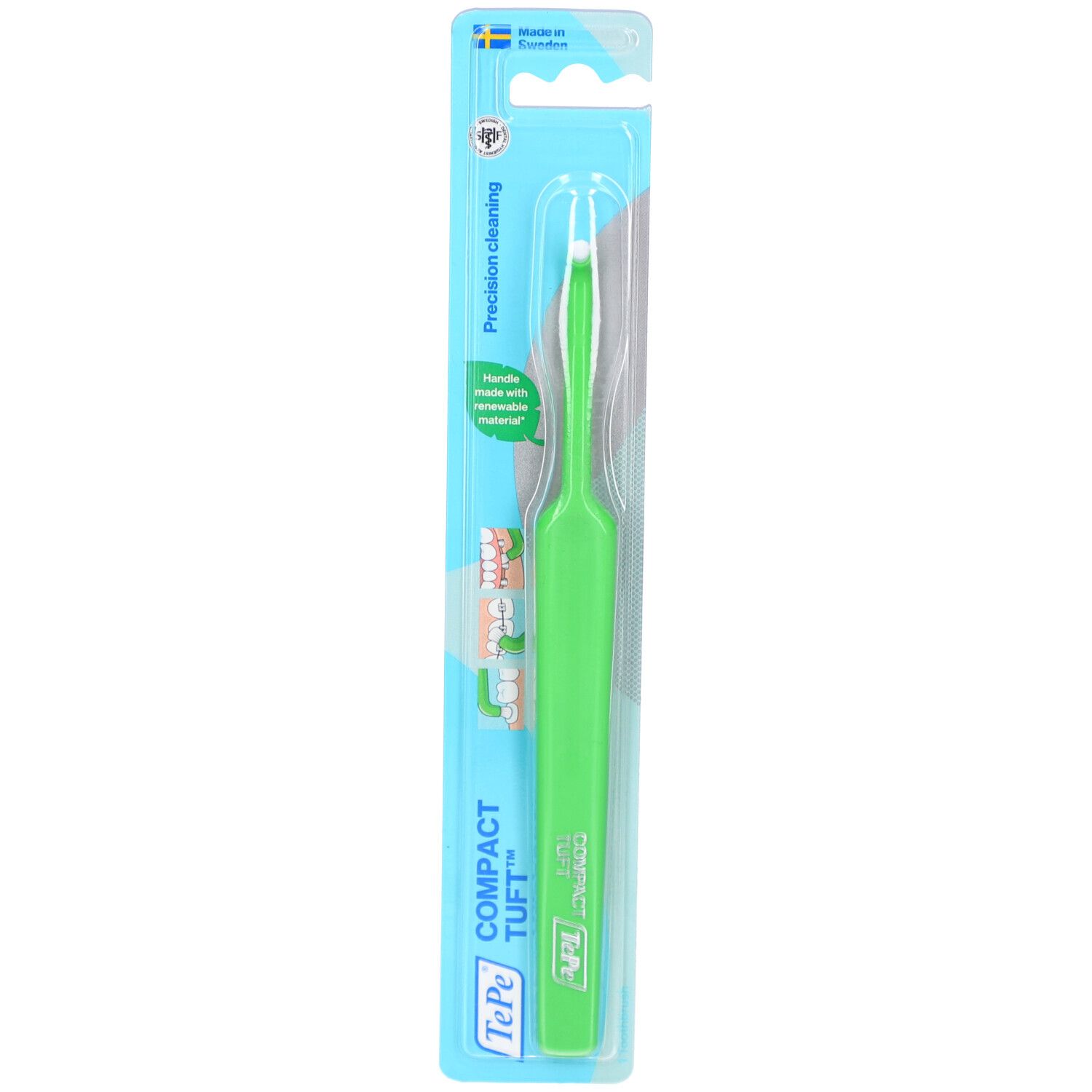 Brosse à dents verte en blister. Tête blanche. Nom du produit et marque visibles.