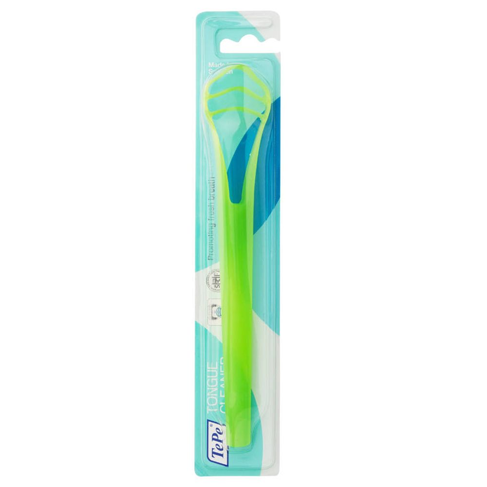 Nettoyeur de langue vert dans un emballage. Le nettoyeur est vert avec une poignée. Logo TePe et "Tongue Cleaner" visibles.