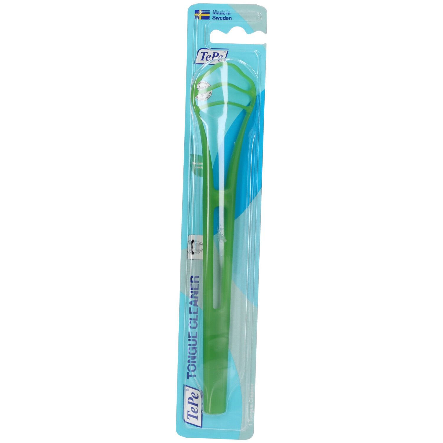 Nettoyeur de langue vert dans un emballage. Le nettoyeur a une poignée verte et une zone de nettoyage. Logo TePe et "Tongue Cleaner" visibles.