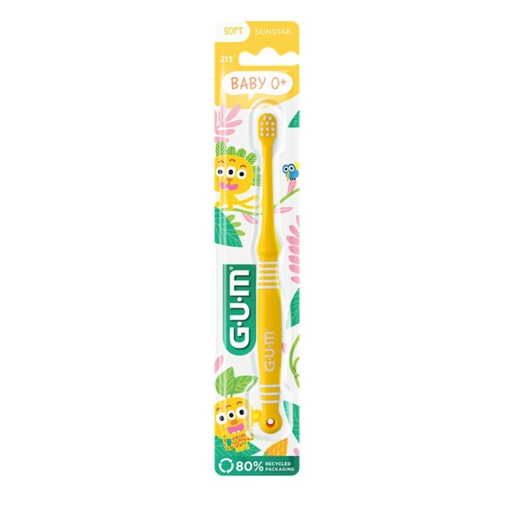 Brosse à dents verte pour bébé dans son emballage. Marque G.U.M, Baby 0+. Soies, manche et emballage visibles.