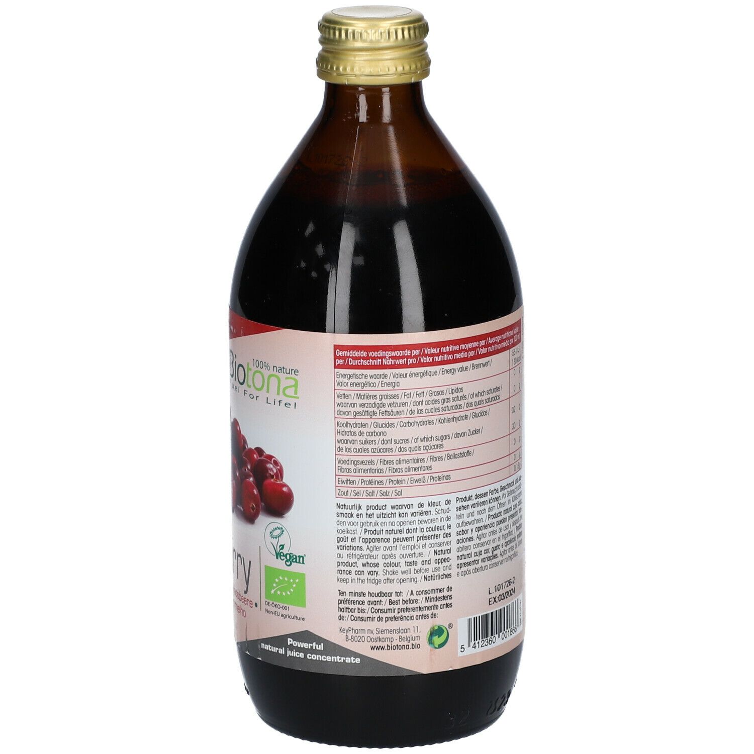 Bouteille en verre brun de concentré de canneberge. Dos avec informations textuelles et étiquette.