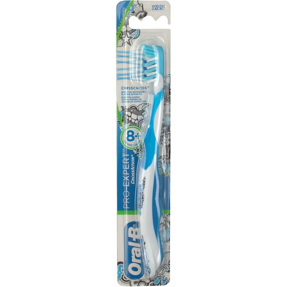 Brosse à dents bleue et blanche. Emballage avec nom du produit et recommandation d'âge.