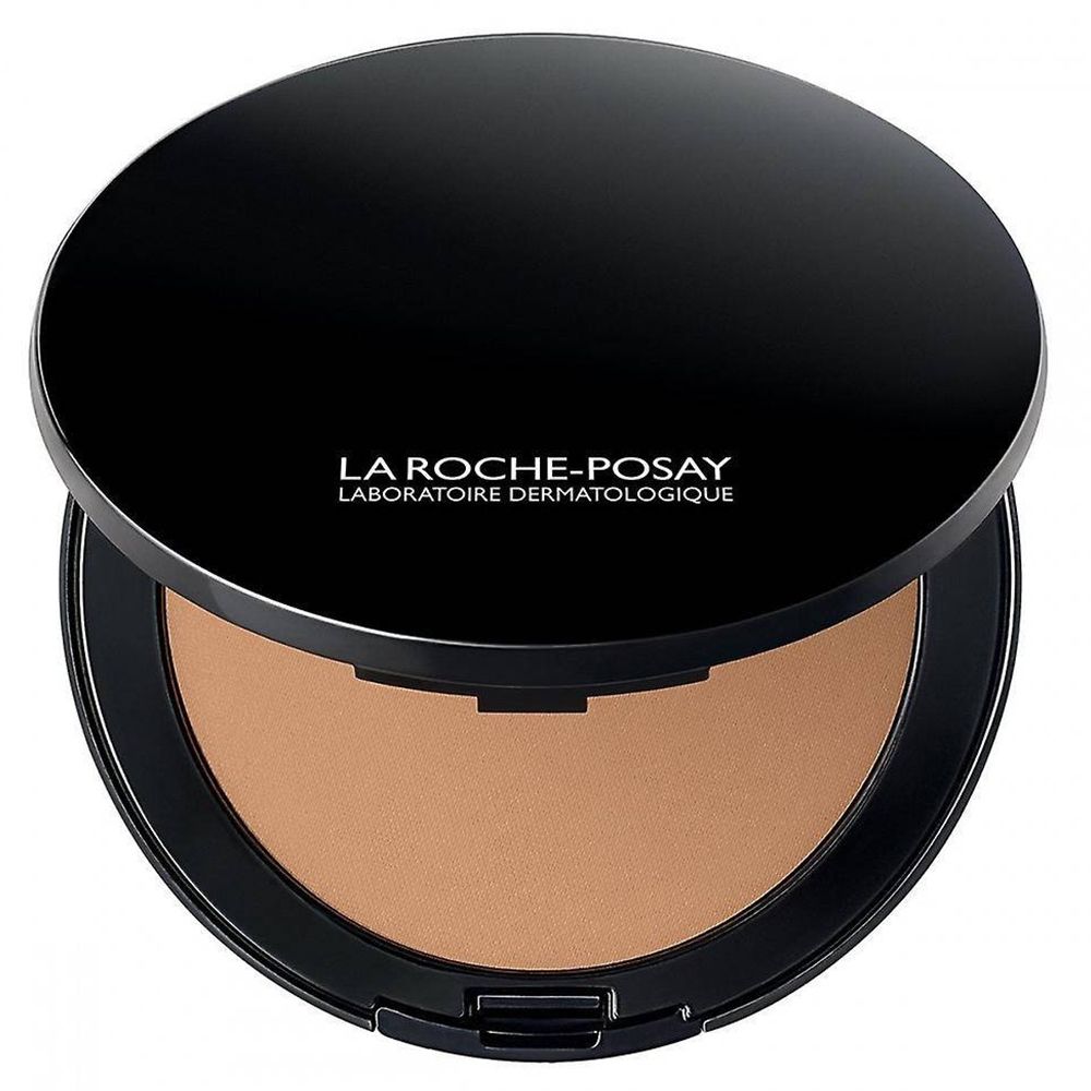 Maquillage compact ouvert. Marque La Roche-Posay. Boîtier noir, couvercle ouvert. Teinte marron clair.