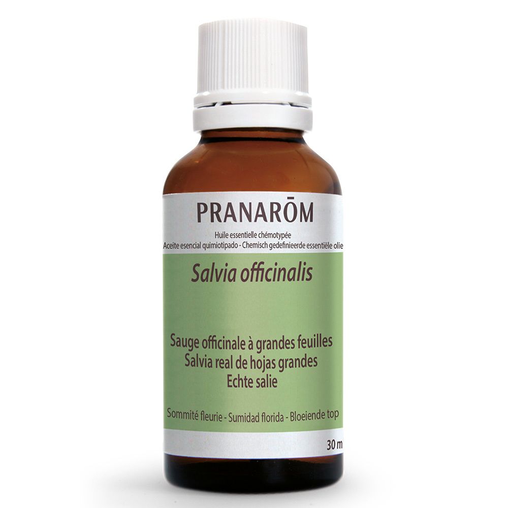 Flacon en verre brun avec bouchon blanc. Étiquette avec nom du produit et marque PRANAROM. Texte multilingue.