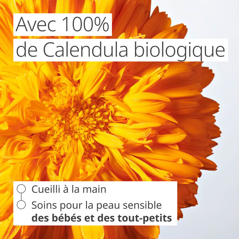 Bouteille Weleda Baby Cremebad avec bouchon jaune, étiquette avec marguerite et coccinelle, 200 ml.