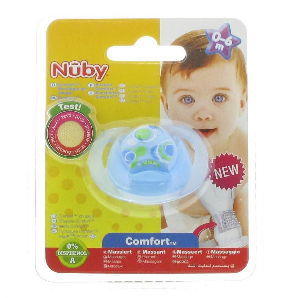 Sucette bleue avec motif vert, emballée dans un blister jaune. Marque Nuby, recommandée pour les bébés de 0 à 6 mois.