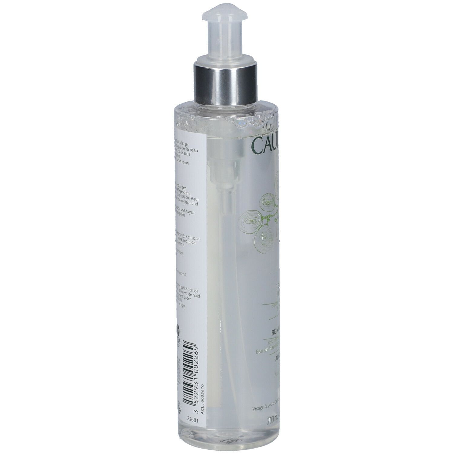 Flacon transparent avec pompe. Inscription CAUDALIE. Étiquette avec informations produit. Flacon légèrement incliné.