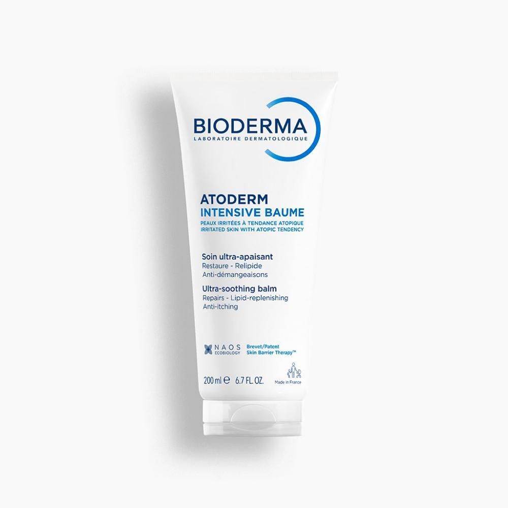 Tube blanc avec logo et texte bleus. Contient Atoderm Intensive Baume. Textes en français et anglais. 200 ml. Produit à côté.