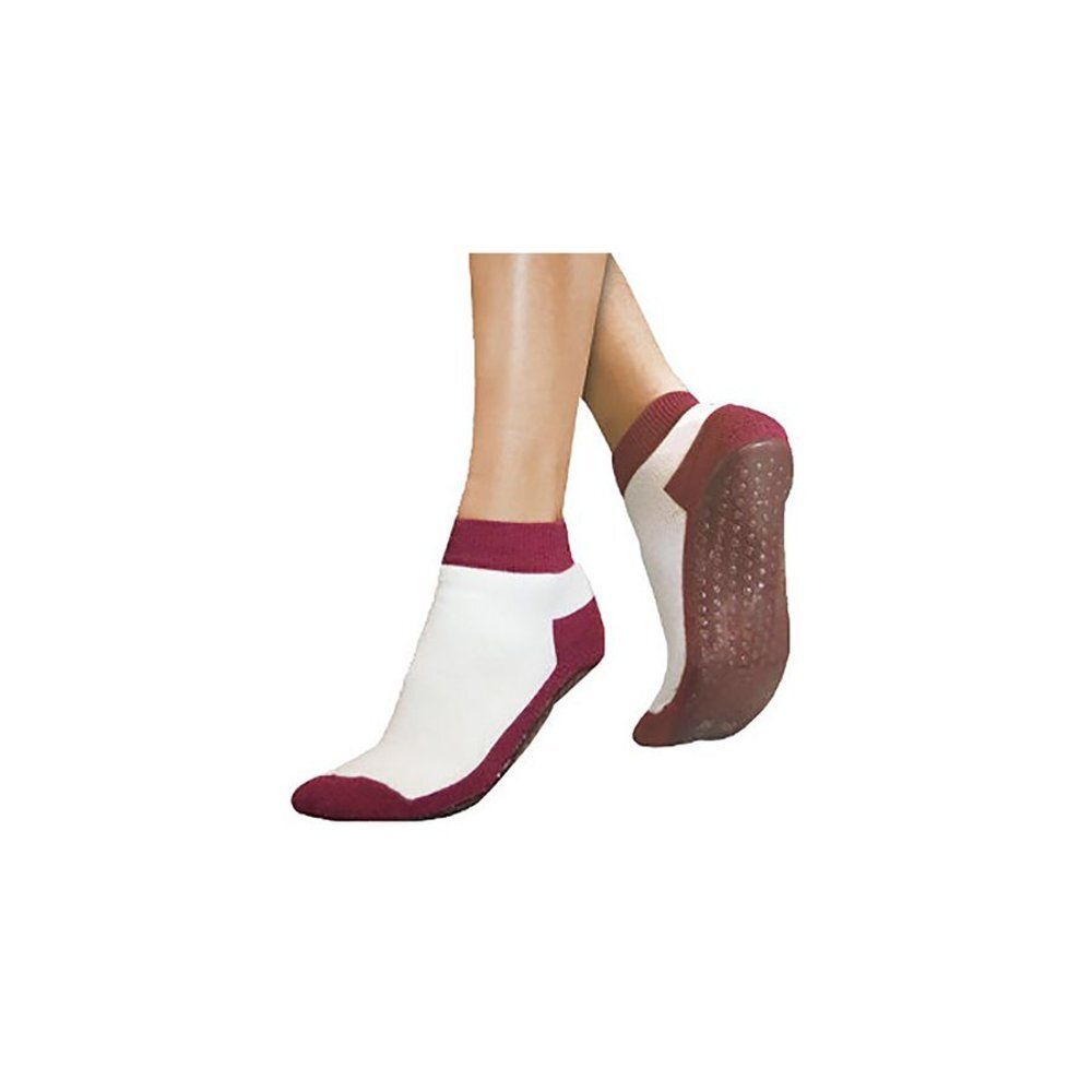 Chaussettes antidérapantes bordeaux portées. Détails blancs et bordeaux. Picots sur la semelle. Marque non visible.