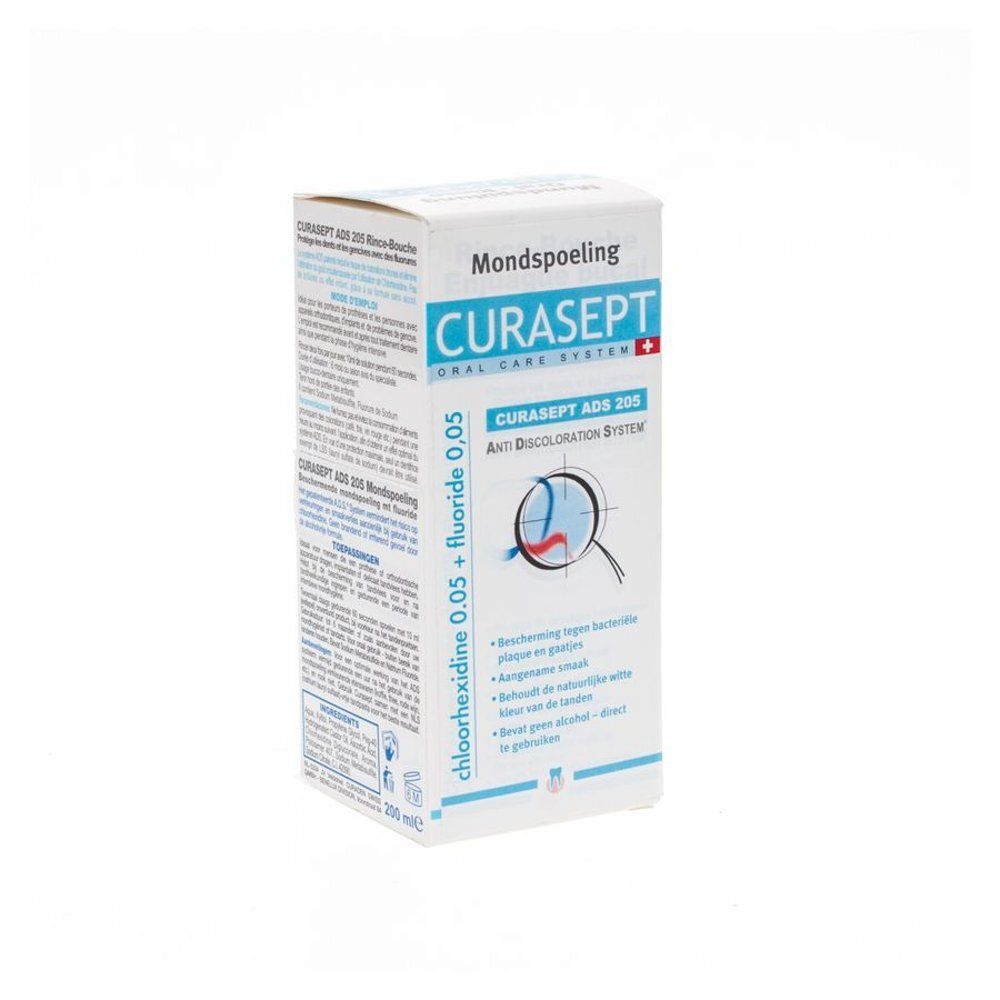 Arrière d'un flacon de bain de bouche CURASEPT ADS 205 avec numéro de lot et date d'expiration.