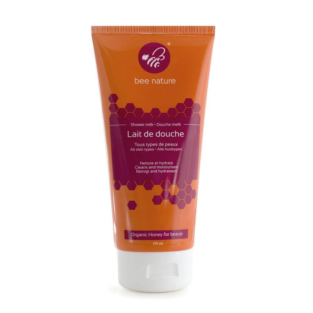 Tube orange avec nom du produit et texte. Contient des informations sur le produit et un logo. Bouchon blanc.
