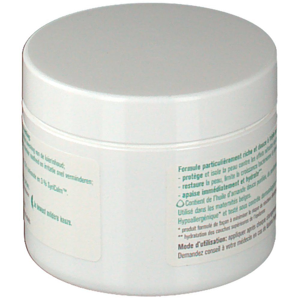 Pot rond blanc avec couvercle. Texte sur l'étiquette concernant les ingrédients et les effets du produit.